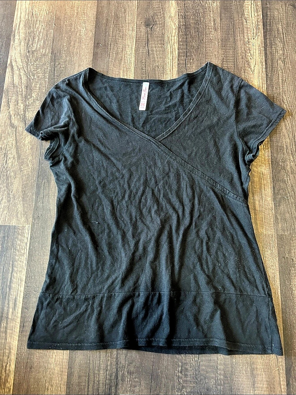 This is a Point Zero Nicole Benisti clothing tag in size XL/TG, made of 100% cot